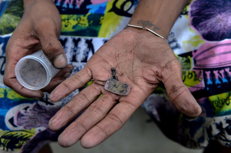 Mineros del río Guaire: vivir de las cloacas de Caracas
