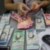 Reaparecen billetes: Venezolanos corren para deshacerse del efectivo ante desconfianza por nueva reconversión